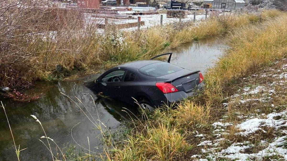 A car partially submerged in a canal in Wanship, Oct. 26, 2023.