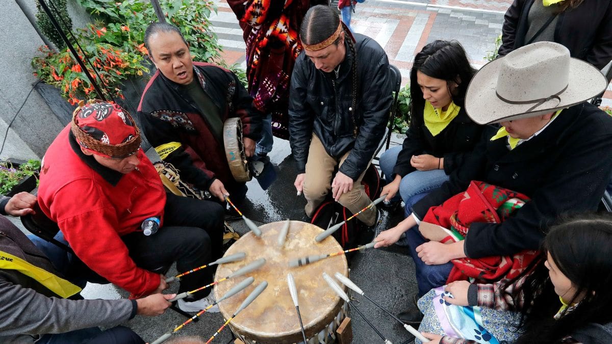 Native Americans and First Nations people join in on a drum circle during an Indigenous Peoples Day blessing and rally before a march, Oct. 8, 2018, in Seattle. Native American people will celebrate their centuries-long history of resilience on Monday, Oct. 9, 2023, through ceremonies, dances and speeches. The events across the United States will come two years after President Joe Biden officially commemorated Indigenous Peoples Day.