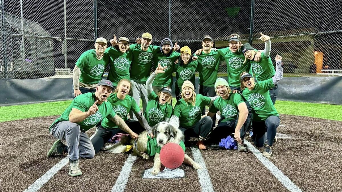 Green Team Dream Team winners of Park City Recreation's Adult League Kickball Tournament Championships complete with dog mascot.