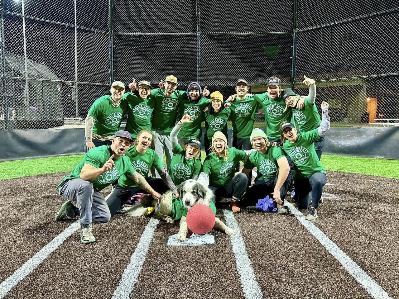 Green Team Dream Team winners of Park City Recreation's Adult League Kickball Tournament Championships complete with dog mascot.