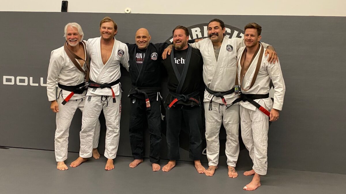 Black belt recipients Chris Wilson (far right) and Keith Barnhart (far left) from Mike Diaz (3rd in from the left) who is the owner at Park City Jiu Jitsu.
