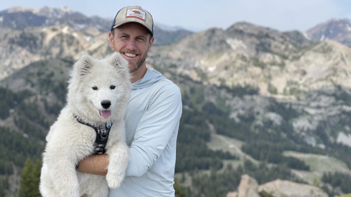 Garen Riedel with Glacier his dog that accompanied him during each/all 12 months of Utah skiing for new Park City goggle company, ArgentaWorks.
