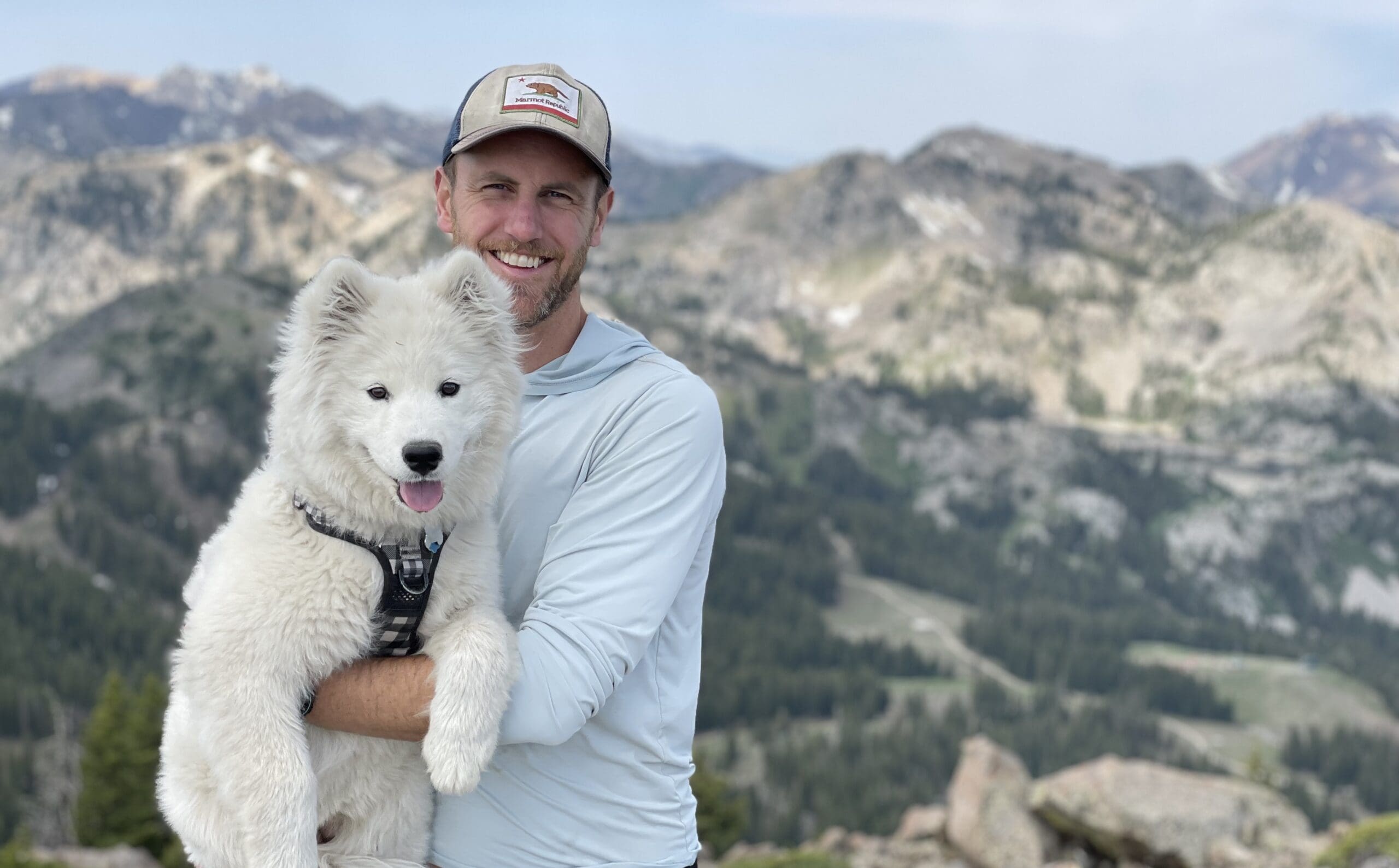 Garen Riedel with Glacier his dog that accompanied him during each/all 12 months of Utah skiing for new Park City goggle company, ArgentaWorks.