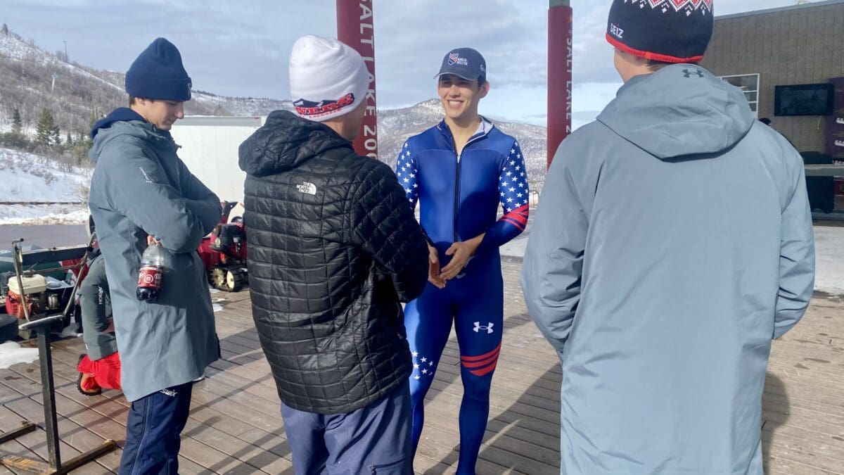 Bradley Nicol, in blue, talking to Noah and Baden Park, in grey, after the IBSF skeleton race at the UOP.