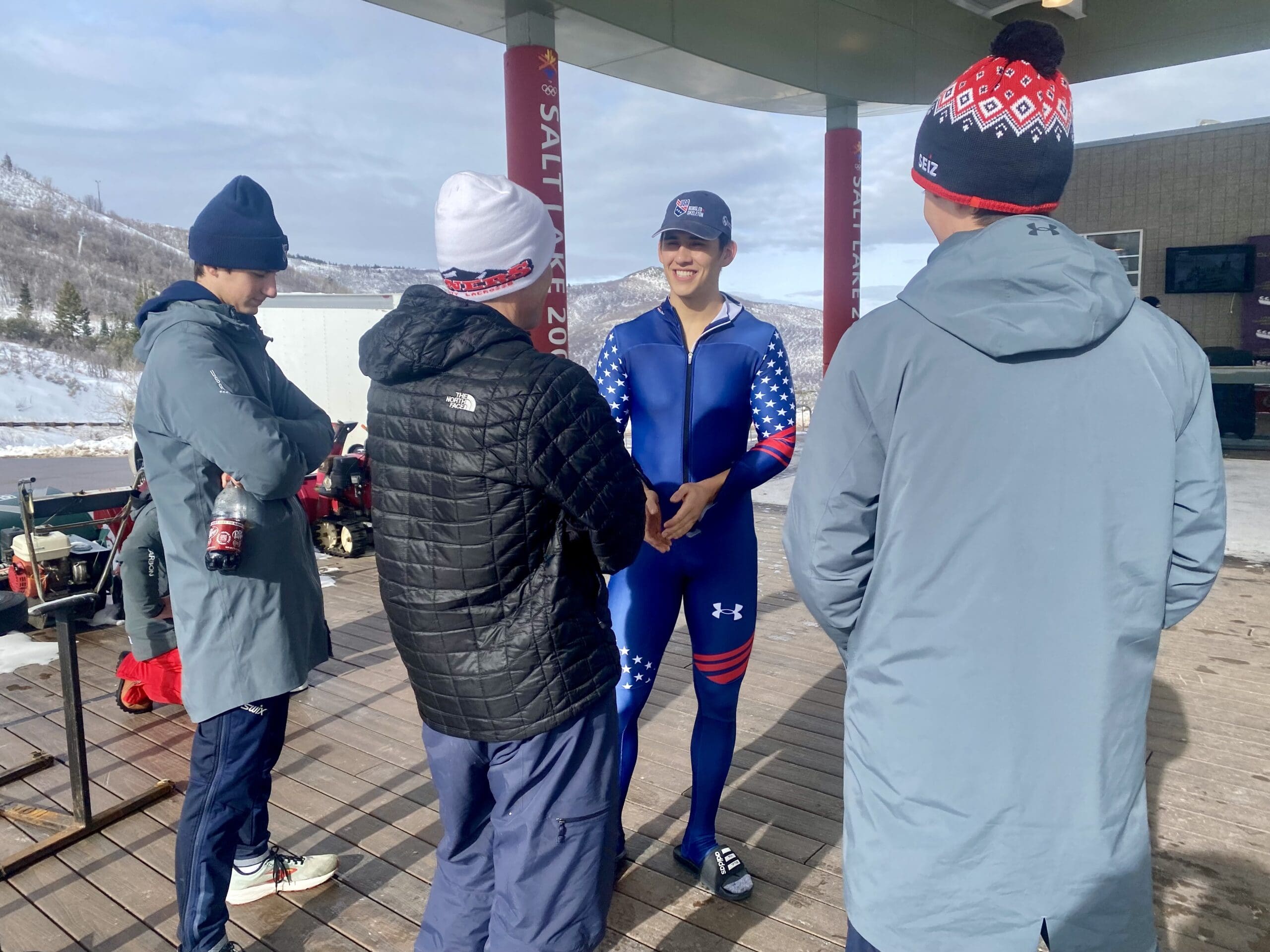 Bradley Nicol, in blue, talking to Noah and Baden Park, in grey, after the IBSF skeleton race at the UOP.