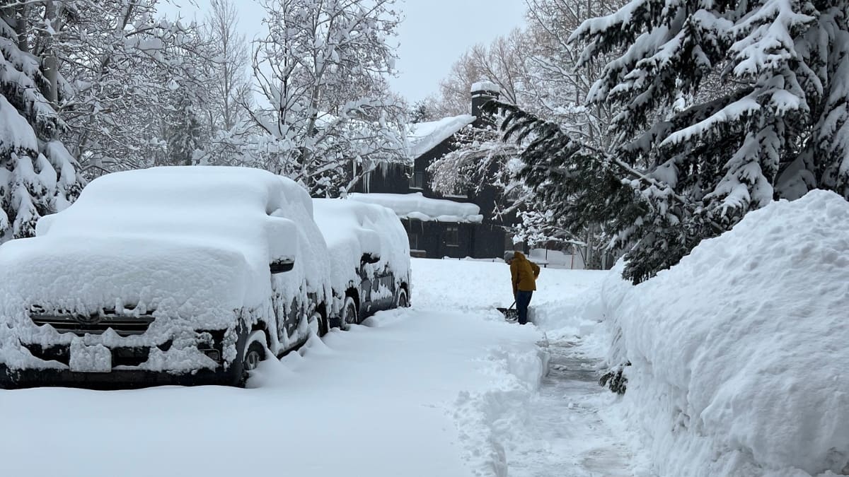 A resident shovels his driveway after a snow storm in Park City, February 2023.