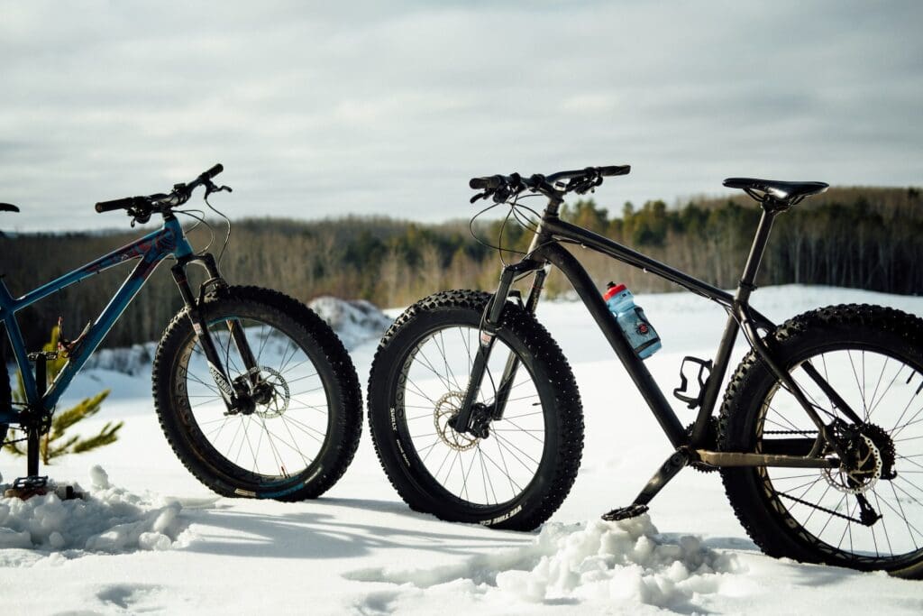 a couple of bikes that are sitting in the snow