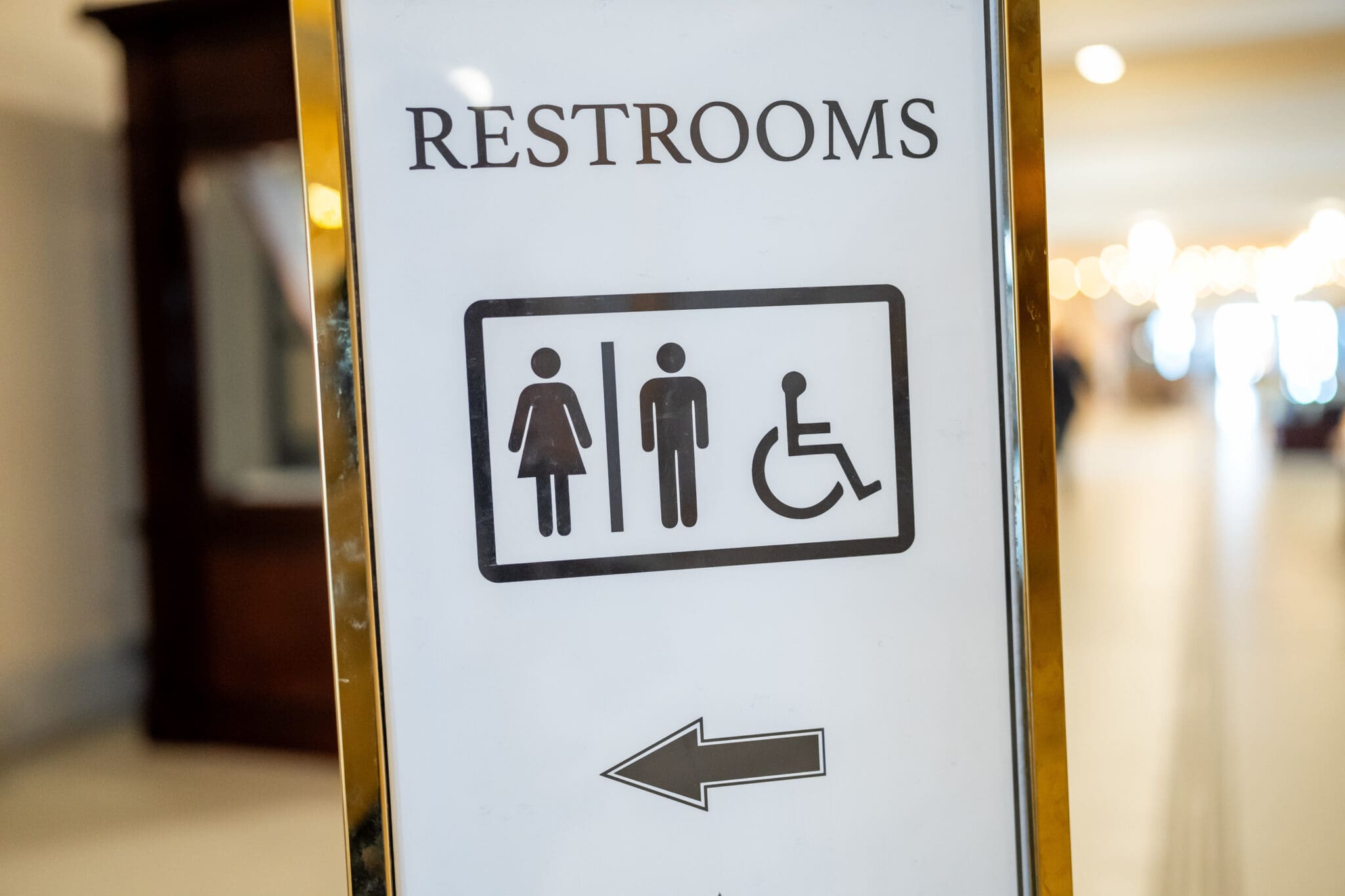 A sign points to bathrooms at the Capitol in Salt Lake City.