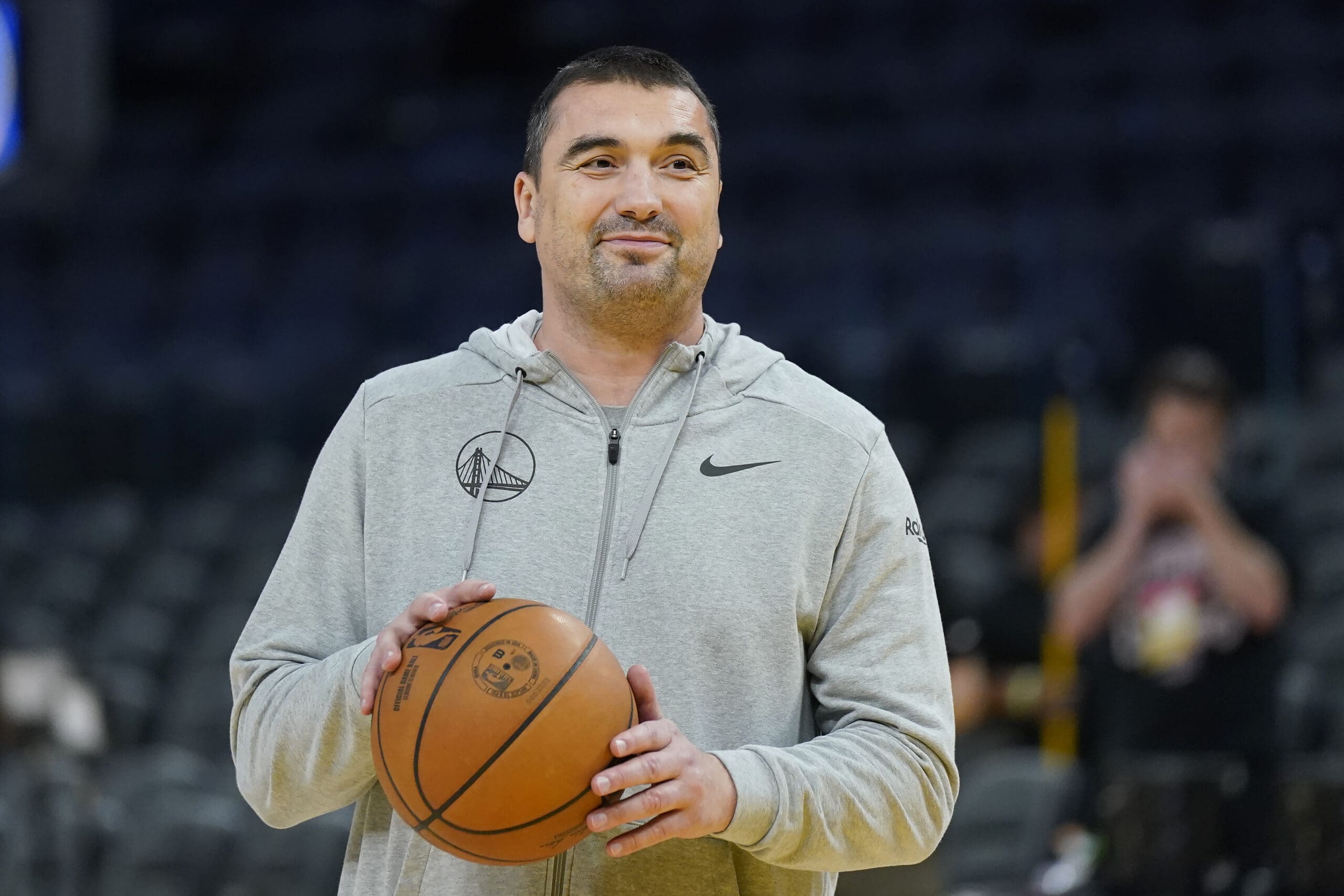 Golden State Warriors assistant coach Dejan Milojevic smiles during an NBA preseason basketball game against the Denver Nuggets San Francisco, Friday, Oct. 14, 2022. Warriors assistant coach Dejan Milojević, a mentor to two-time NBA MVP Nikola Jokic and a former star player in his native Serbia, died Wednesday, Jan. 17, 2024, after suffering a heart attack, the team announced. Milojević, part of the staff that helped the Warriors win the 2022 NBA championship, was 46.