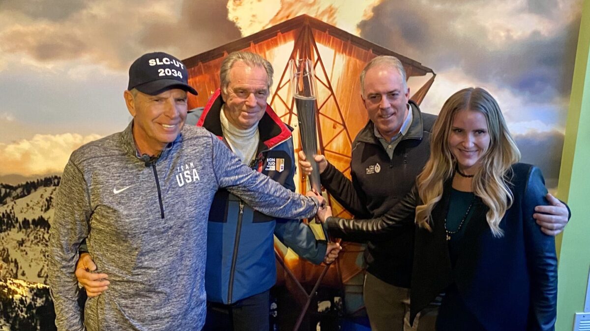 (R-L) Frasier Bullock, Renaud Muselier, Colin Hilton, and Malena Stevens holding the 2002 Olympic Torch at the Olympic Museum in Park City after touring Olympic facilities and discussing France and USA's partnership within the IOC.