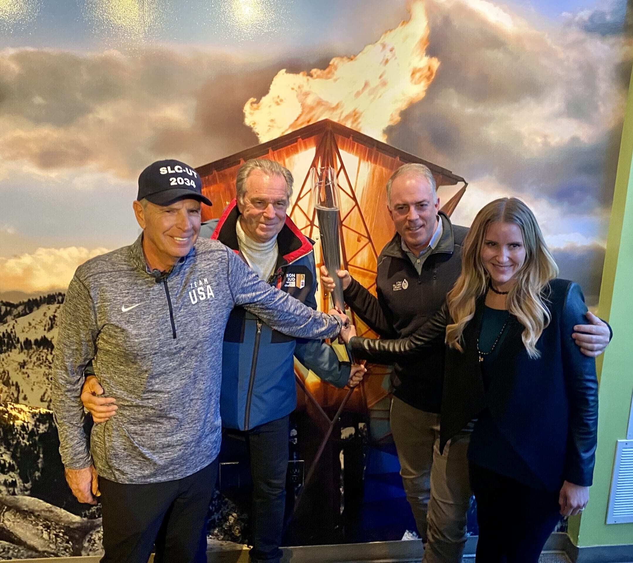 (R-L) Frasier Bullock, Renaud Muselier, Colin Hilton, and Malena Stevens holding the 2002 Olympic Torch at the Olympic Museum in Park City after touring Olympic facilities and discussing France and USA's partnership within the IOC.