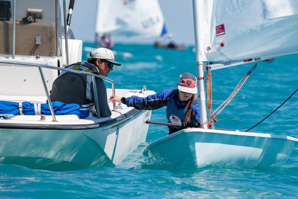 Coach Christian (L) giving pointers to Morgan Vesko in Miami at U.S. Olympic Sailing Team Trials.