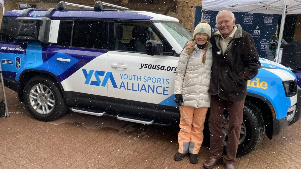 Youth Sports Alliance's executive director Emily Fisher and founder Jim Gaddis proudly show off the new Land Rover at Deer Valley. YSA won the car with the most votes in a nationwide nonprofit contest.