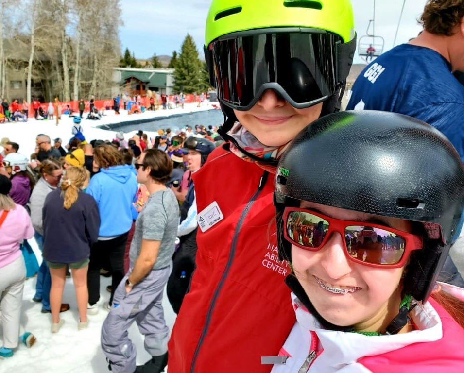 Izzy and her friend Brooke skiing together.