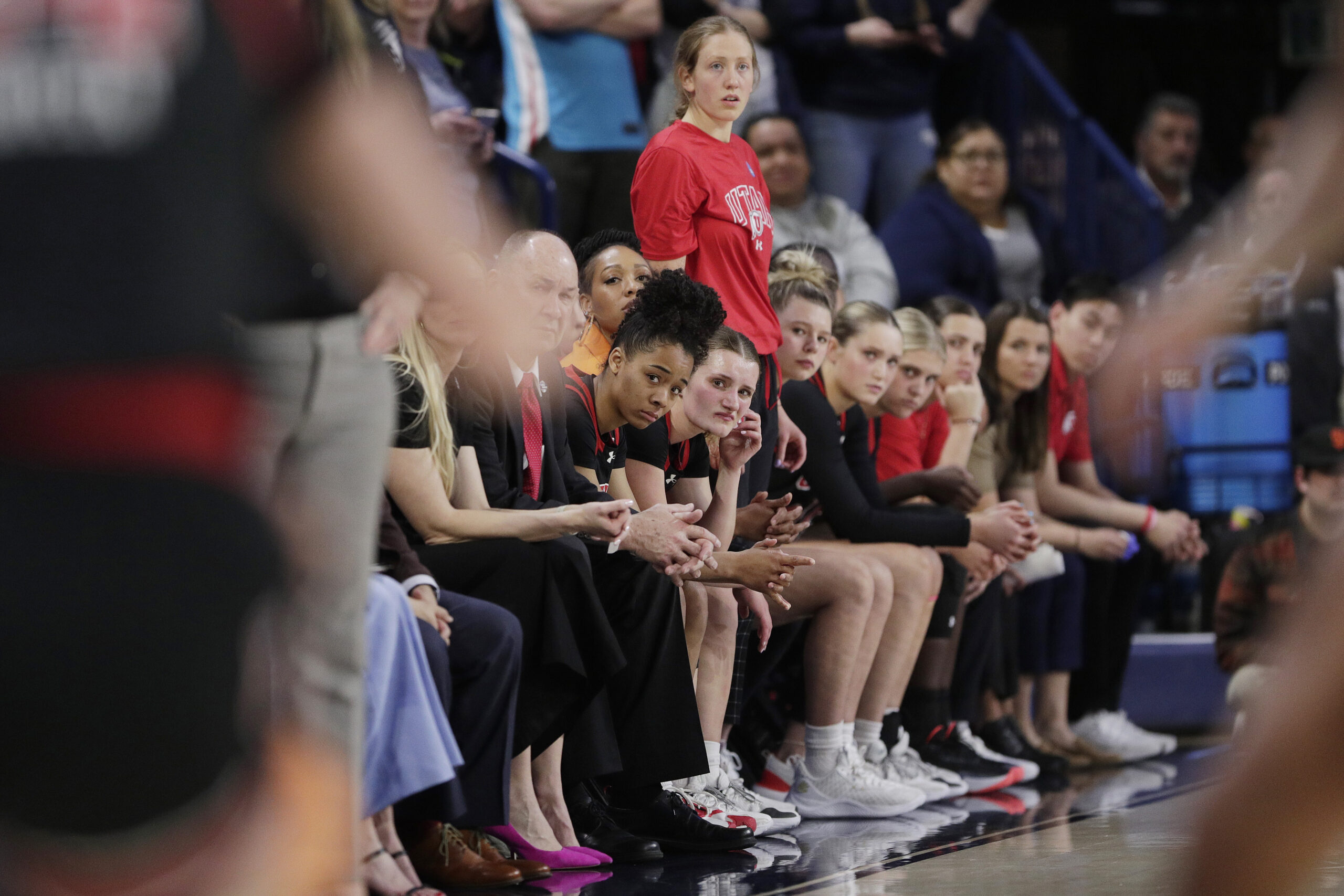 Players and staff on the Utah bench react toward the end of a second-round college basketball game against Gonzaga in the NCAA Tournament in Spokane, Wash.