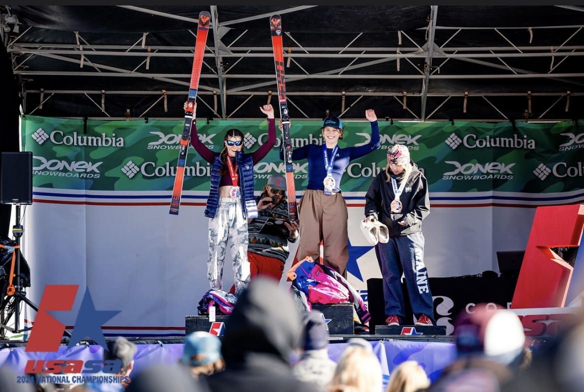 Ashley Sell and Cayenne Wilson on the podium.