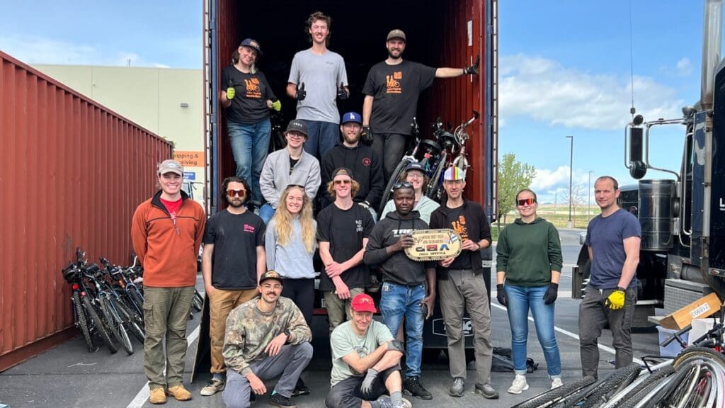 Village Bicycle Project volunteers loading a shipping container bound for Africa.