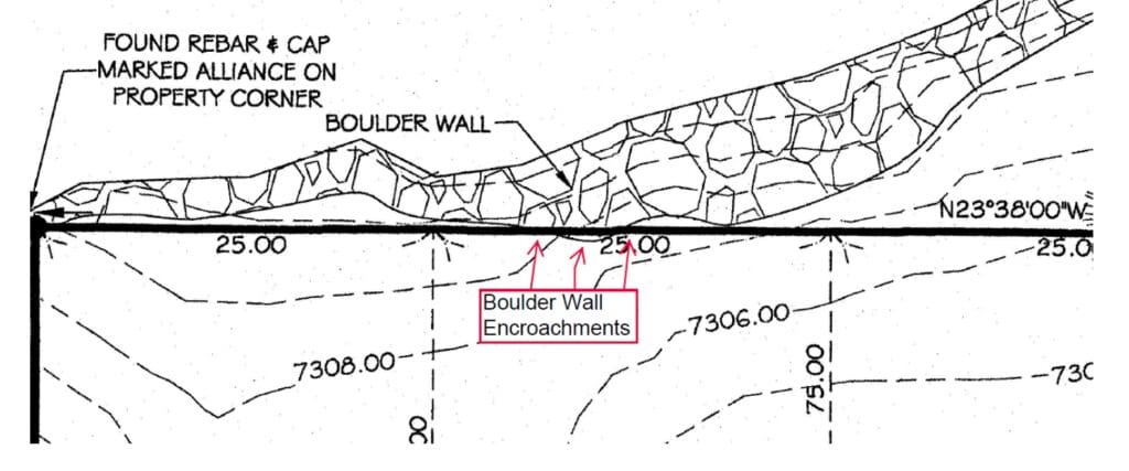 Area where the lawsuit claims the retaining wall encrouches on the plantifs land.