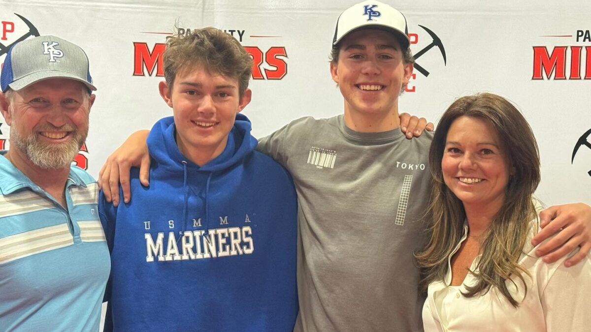 (R-L) Dad, Joel; Calvin; younger brother and PCHS Junior, Jeremiah; and Mom, Casey Marsh at Calvin's college signing day. In this photo taken at Park City High School, Calvin's dad and brother are wearing hats from his new school at King's Point (KP).