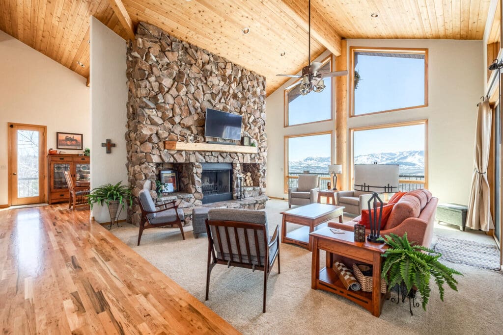 Aspen Lane living room with stone fireplace