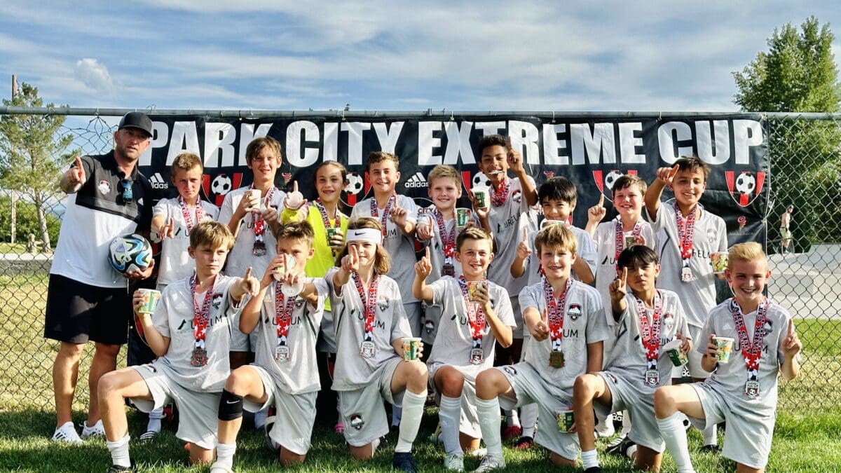 Coach Eli Ulvi with the U13 boys after winning their division in Extreme Cup, July 2023.