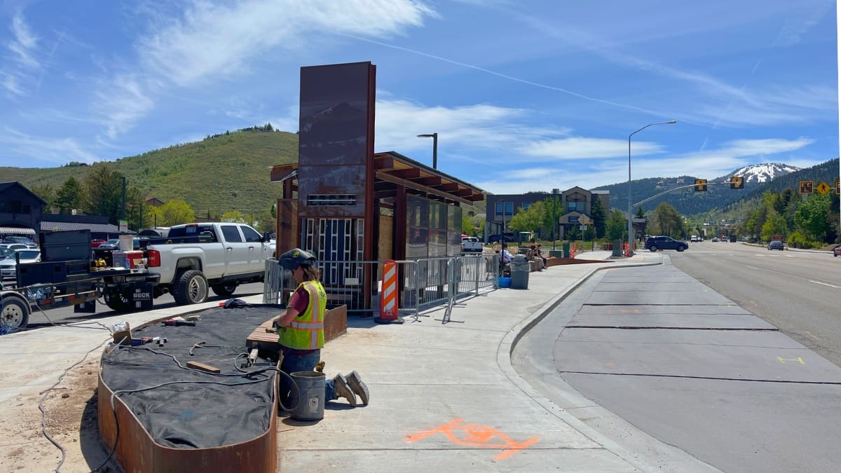 The bus stop at Fresh Market is undergoing major improvements including outdoor seating area and ski racks.