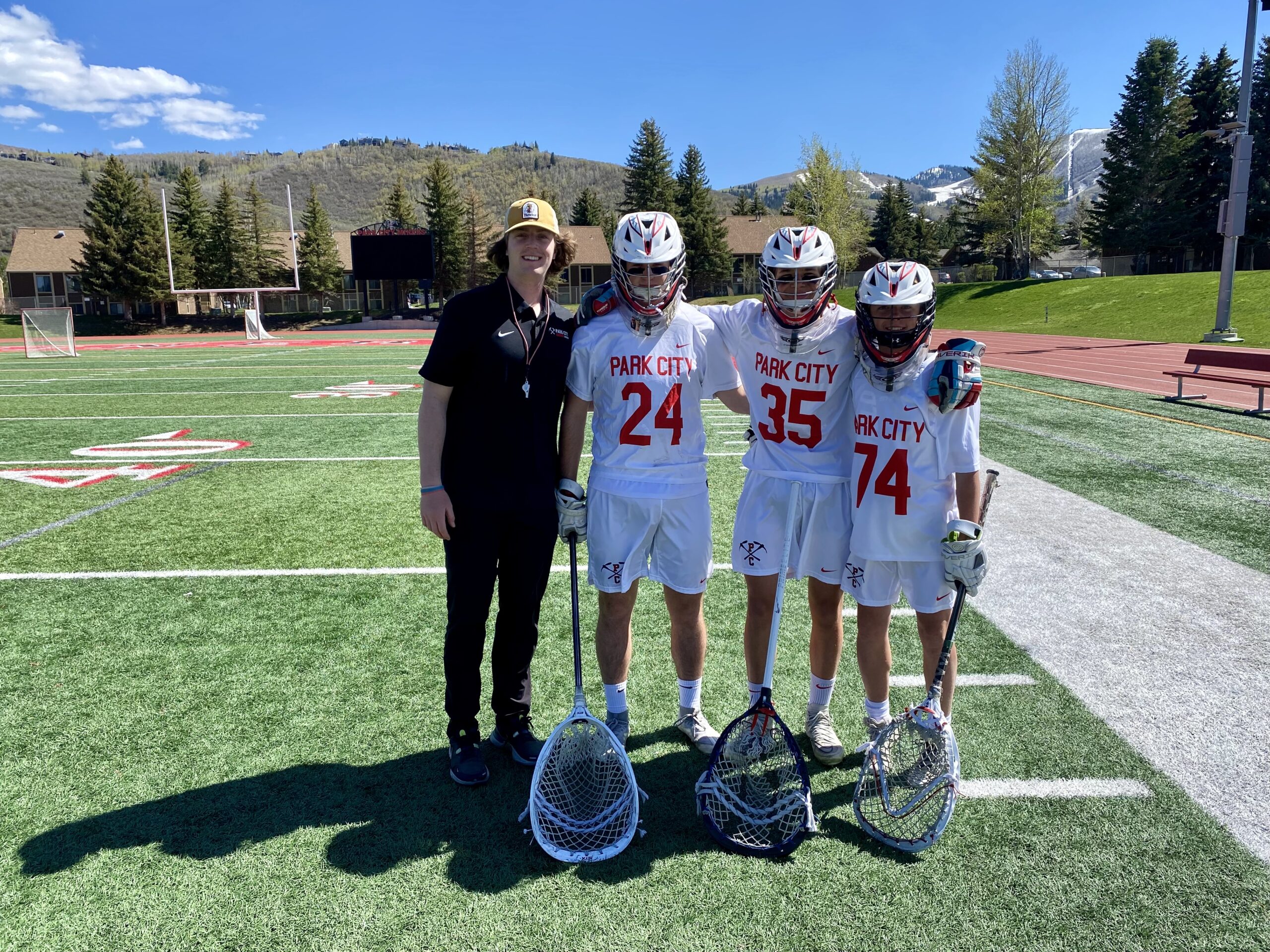 Park City High School's boys, and the girls lacrosse teams played playoff games at home on Thursday. Pictured (L-R) Boys Goalie Coach Kyle Cord, Senior and Goalie A.J. Silianoff, Sophomore Max Gordon, and Sophomore Henry Birch at Dozier Field before their game.