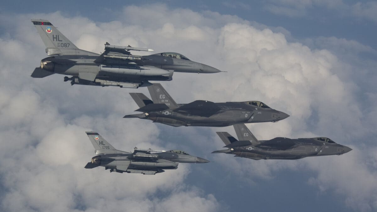 F-16s from Hill Air Force Base fly next to the F-35A Lightning II, the Air Force’s newest fighter jet, in a training mission at Eglin AFB, Fla., Thursday. Hill AFB is slated to receive its first operational F-35s in the fall of 2015.