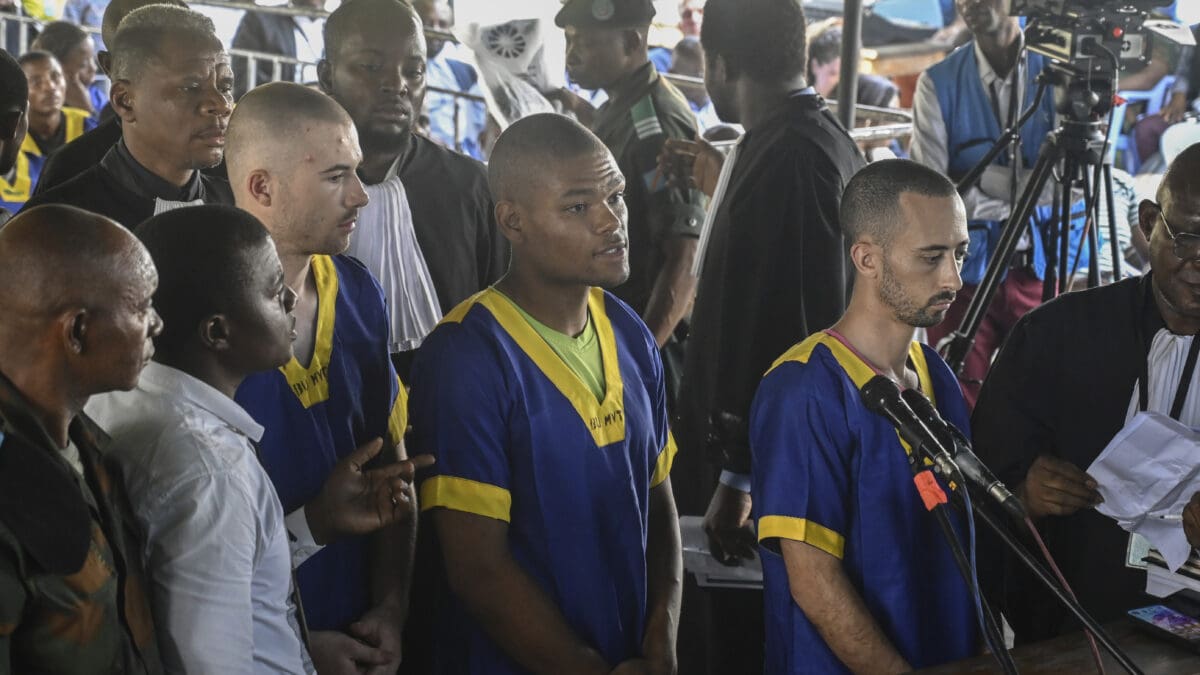 From left T,yler Thompson Jr, Marcel Malanga and Benjamin Reuben Zalman-Polun, all American citizens, face the court in Kinshasa with 52 other defendants Friday June 7, 2024, accused of a role in last month's attempted coup in Congo led by little-known opposition figure Christian Malanga in which six people were killed.