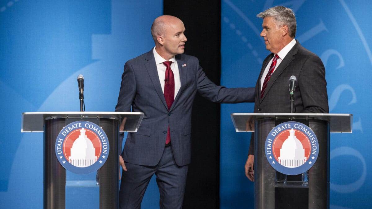 Incumbent Gov. Spencer Cox, left, talks with Utah Rep. Phil Lyman before Utah’s gubernatorial GOP primary debate held at the Eccles Broadcast Center in Salt Lake City on Tuesday, June 11, 2024.