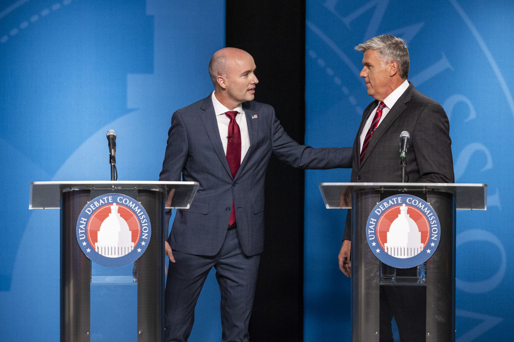 Incumbent Gov. Spencer Cox, left, talks with Utah Rep. Phil Lyman before Utah’s gubernatorial GOP primary debate held at the Eccles Broadcast Center in Salt Lake City on Tuesday, June 11, 2024.