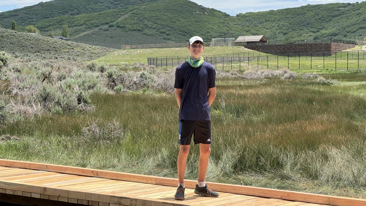 Henry Armentrout with the Puncheon Bridge he constructed with the help of Basin Recreation.