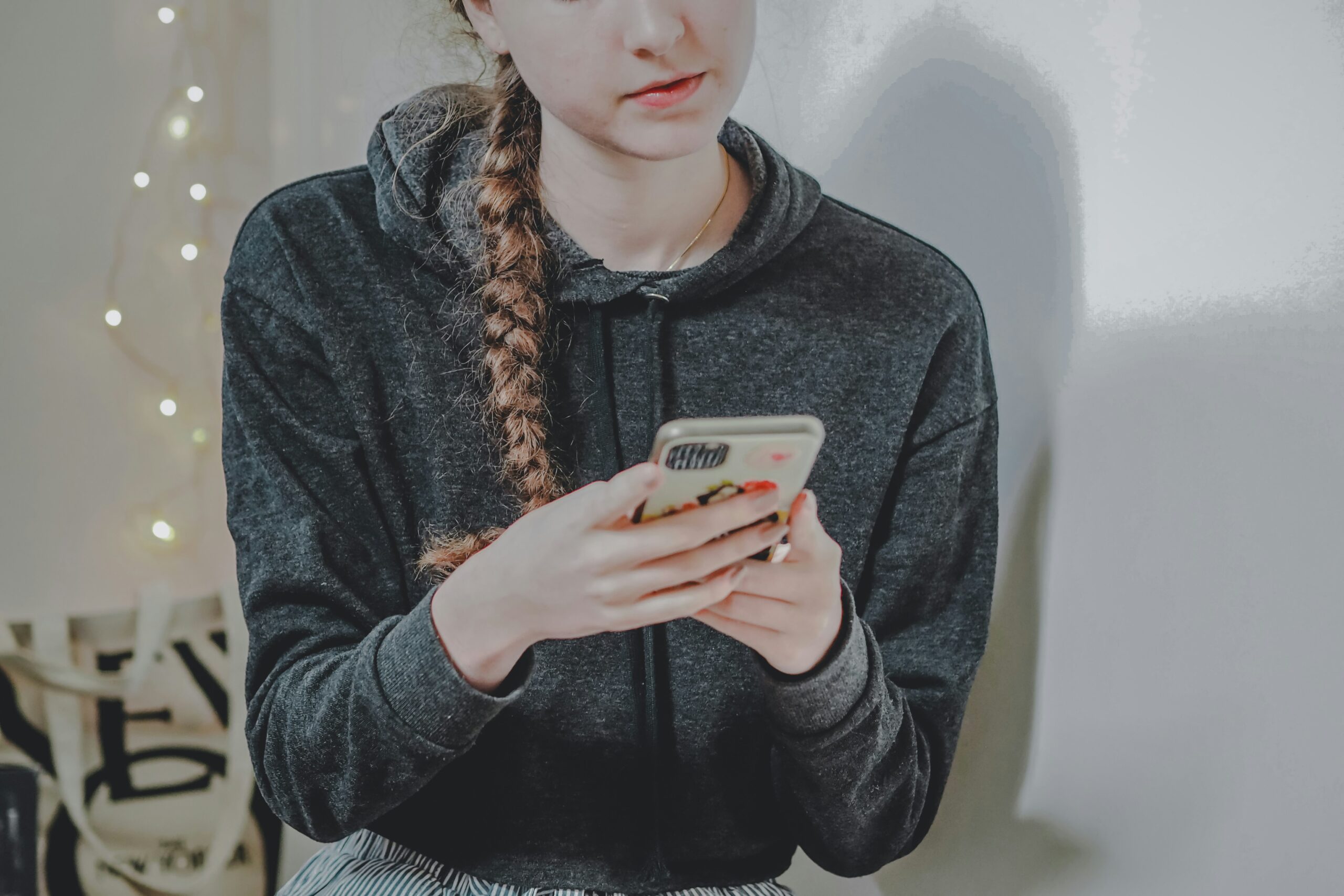 Teenager on smartphone.