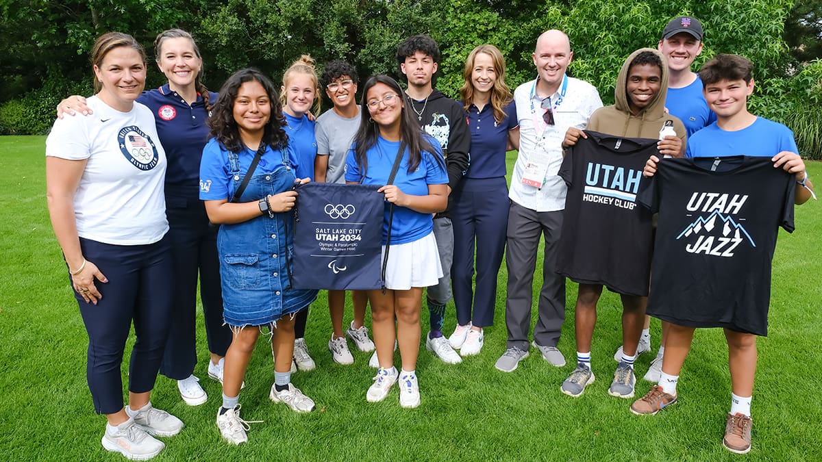 Over 500 youth from 36 nations participate in Festival 24, including six teens from Utah, pictured here along with Utah Governor Spencer Cox, SLC Mayor Erin Mendehall and Salt Lake City-Utah 2034 Board Chair Catherine Raney Norman.