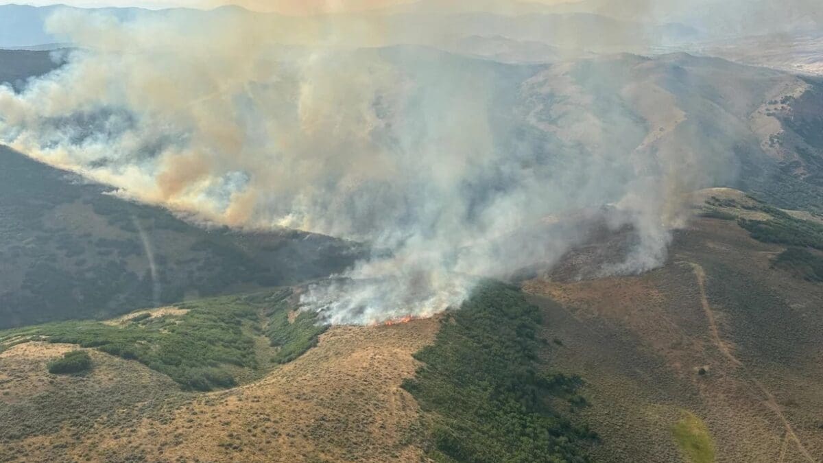 The Dikker Hill fire burns in the grassy hills east of Coalville near Echo Reservoir.