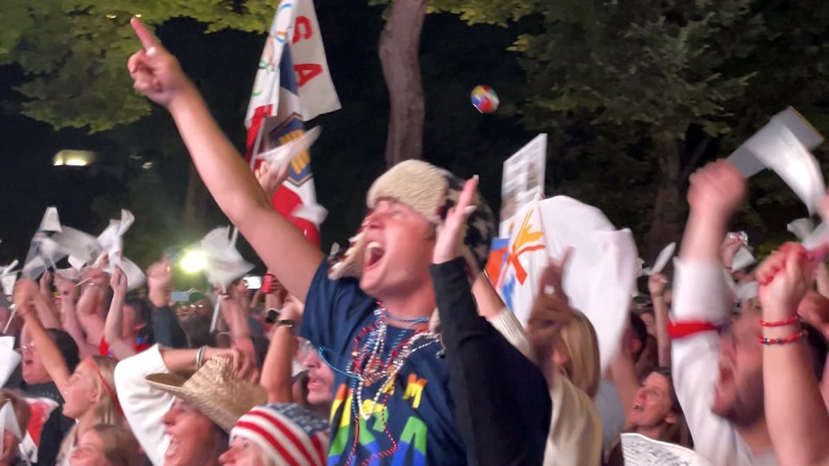 Members of the crowd cheer in downtown Salt Lake City as the official Olympics announcement is made.