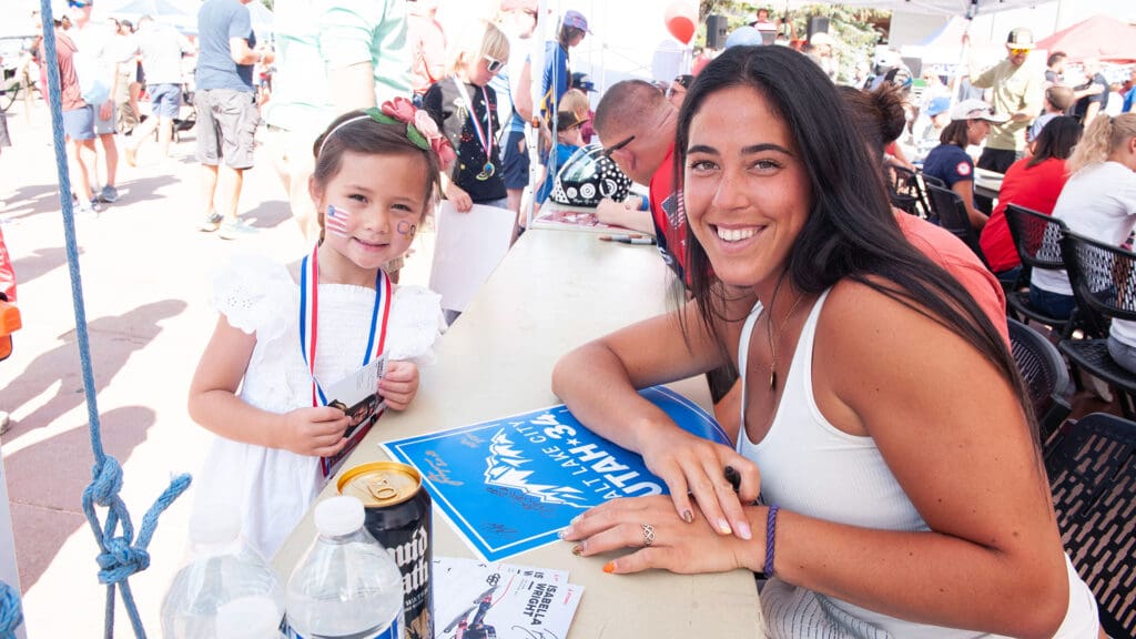 US Ski Team star Bella Wright, a Snowbird skier, signs autographs Wednesday at the Utah Olympic Park 2034 Party.