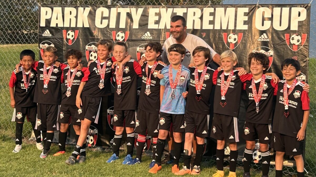 Extreme Cup Championship Team from Park City Soccer Club for the Boys 2015 birth year, (Red) with coach Matt Terwillegar.