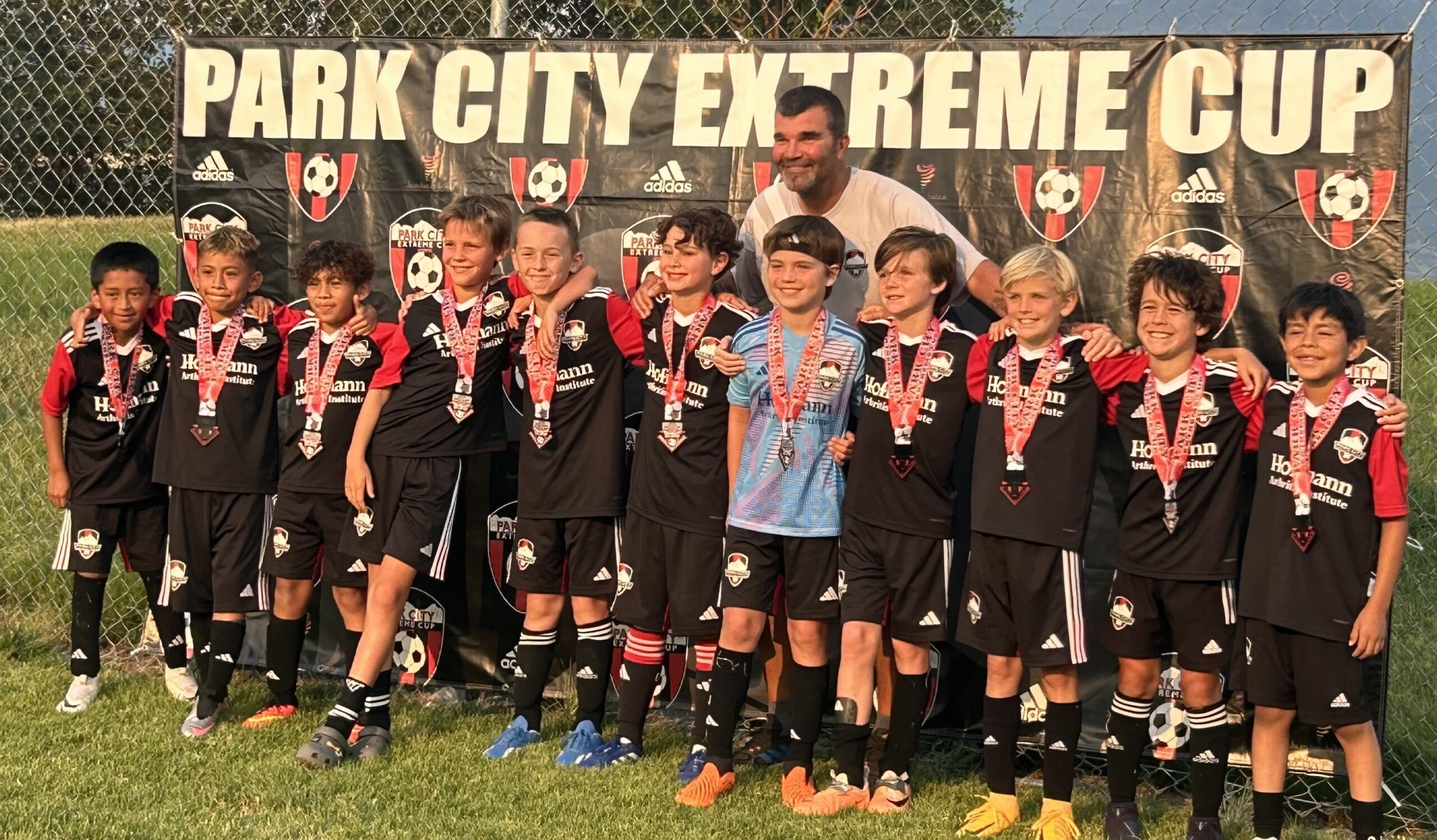 Extreme Cup Championship Team from Park City Soccer Club for the Boys 2015 birth year, (Red) with coach Matt Terwillegar.