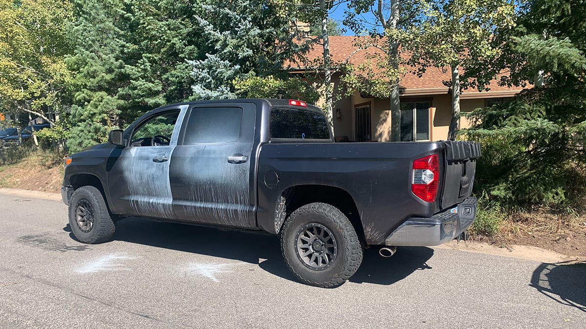 Police dust a recovered stolen truck for fingerprints in Sun Peak on Monday, August 26, 2024.