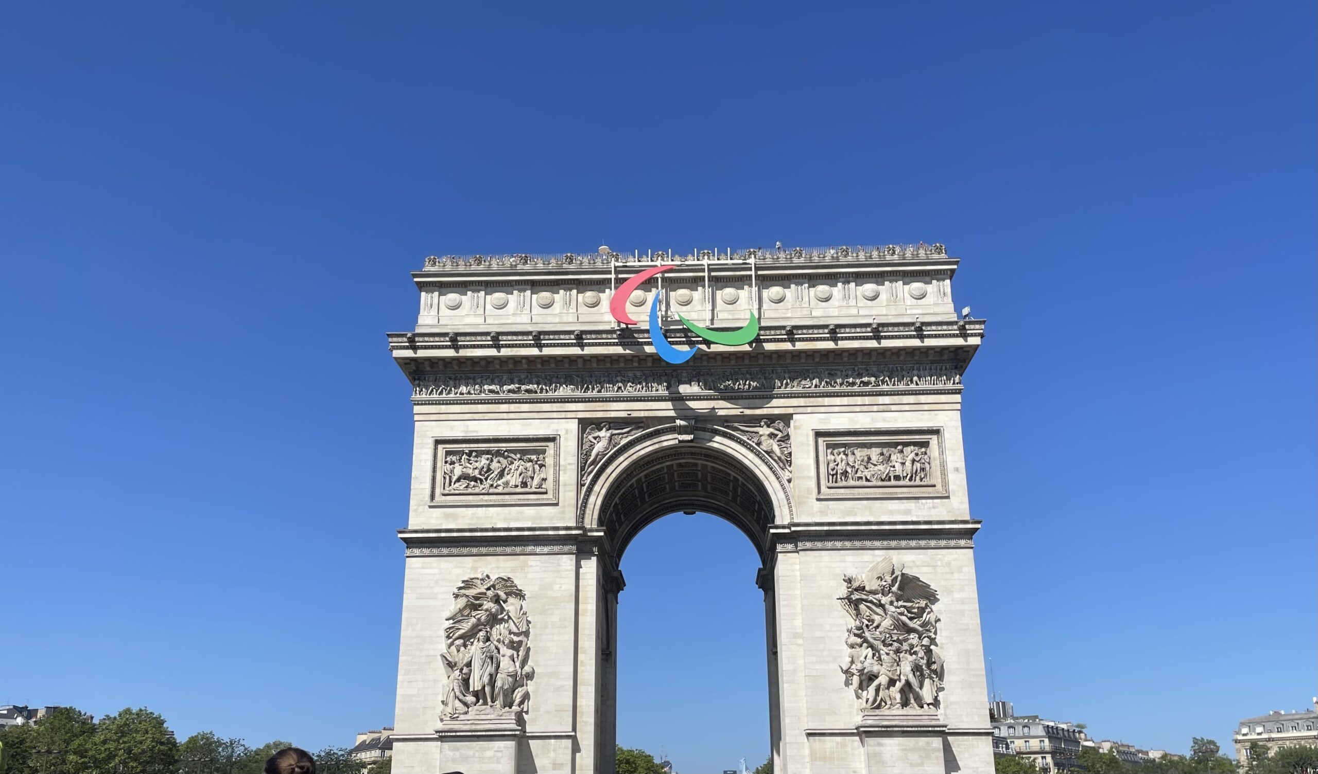 Paris' Arc De Triomphe adorned with the Paralympics symbol.