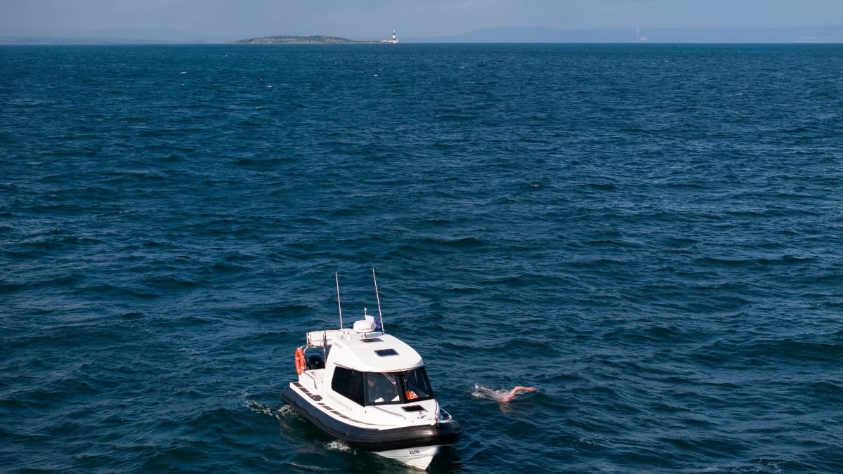 The support boat with Rob Lea as he swims across the North Channel.