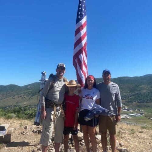 Shelby Hladon with her husband John, and Mat Young and his son Alex.