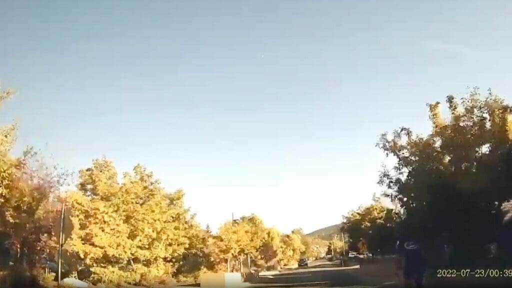 A screenshot of the dash cam video showing Peacock biking.