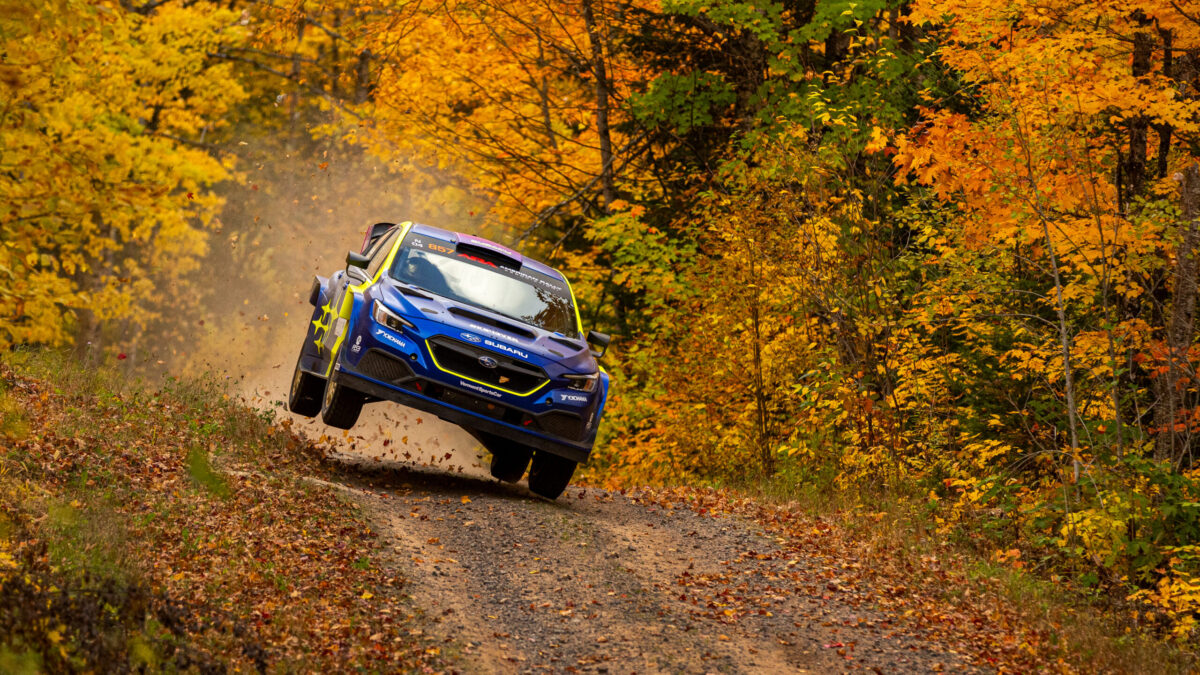 Lia Block driving against Travis Pastrana in Michigan.