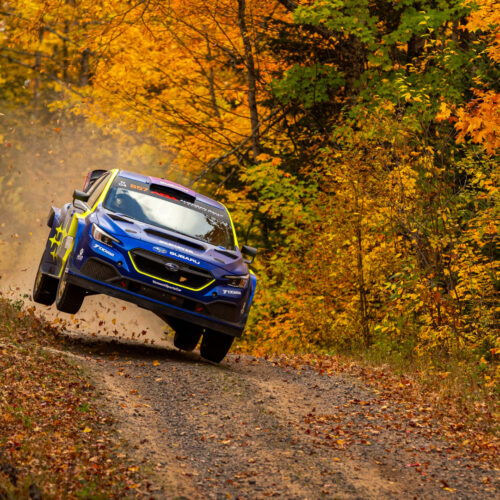 Lia Block driving against Travis Pastrana in Michigan.