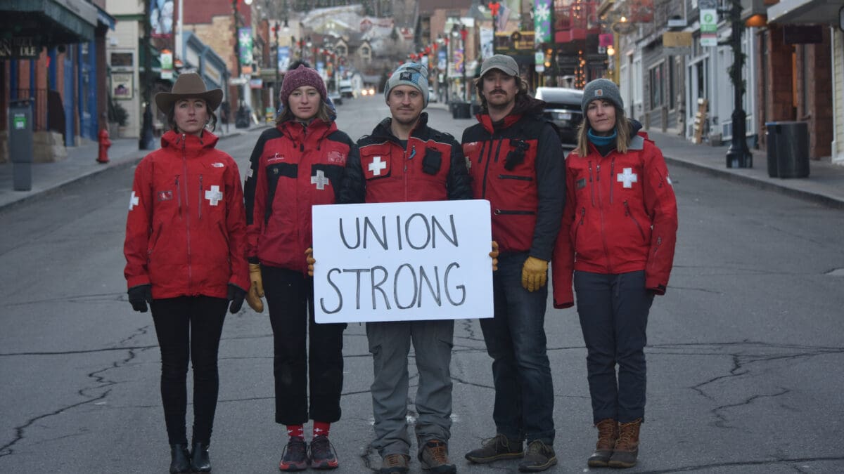 Members of the Park City Professional Ski Patrol Association (PCPSPA) stand united on Main Street, holding a sign that reads "Union Strong," as they continue contract negotiations with Vail Resorts ahead of the 2024-25 ski season.