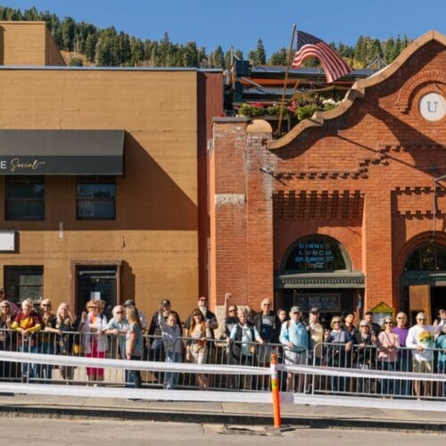 Attendess of the Park City 1970's Reunion pose outside before the annual Shot Ski.