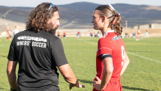 Anthony DiCicco communicating the winning plan to player.