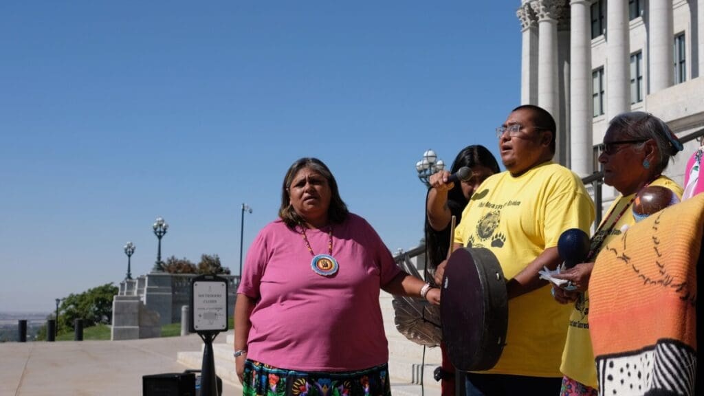 Yolanda Badback (left) of the Ute Mountain Ute Tribe sings during a protest against the White Mesa Uranium Mill outside the Utah Capitol Building in Salt Lake City on Friday, Oct. 4, 2024. 